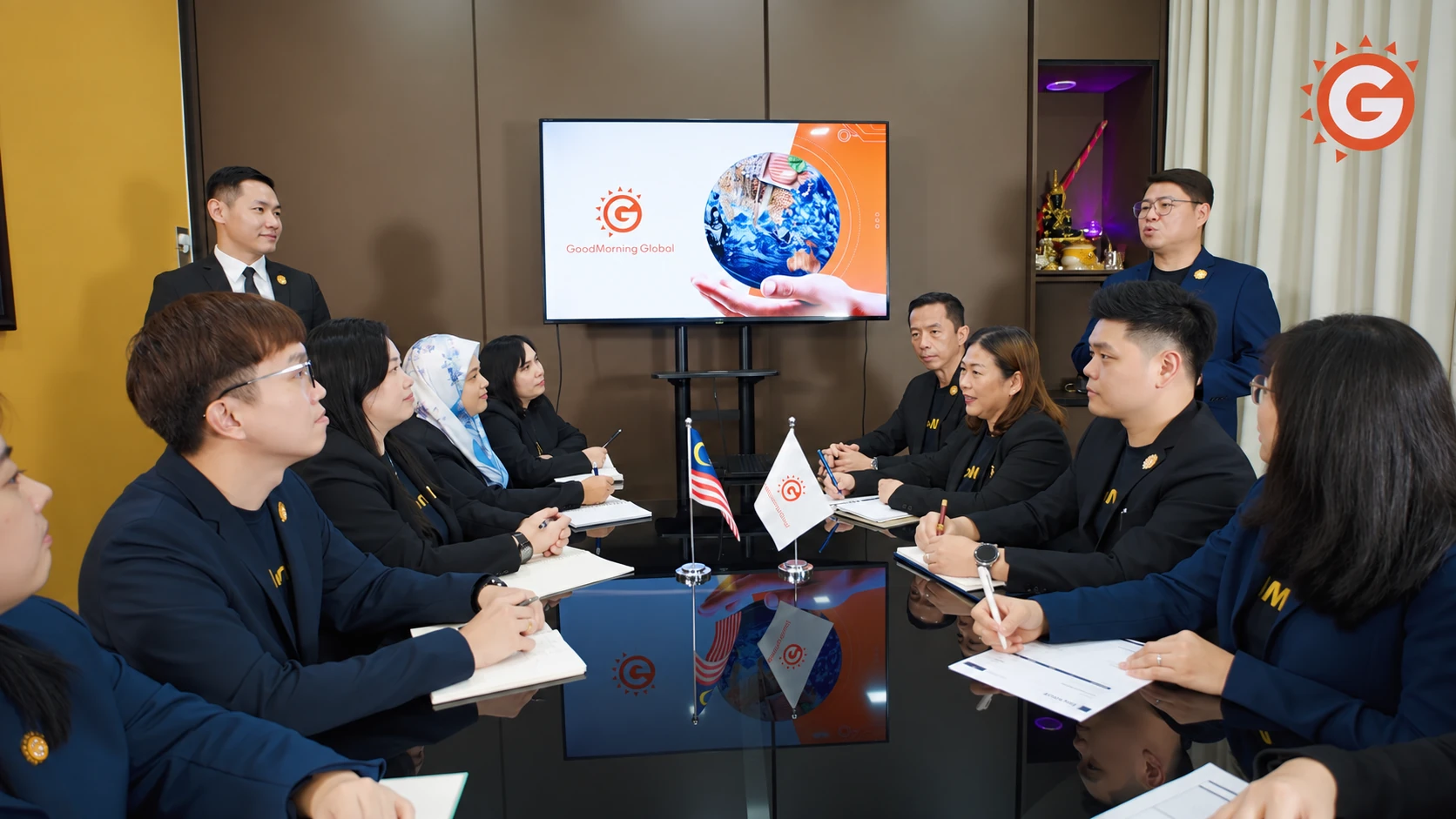 GoodMorning Global team meeting around a conference table