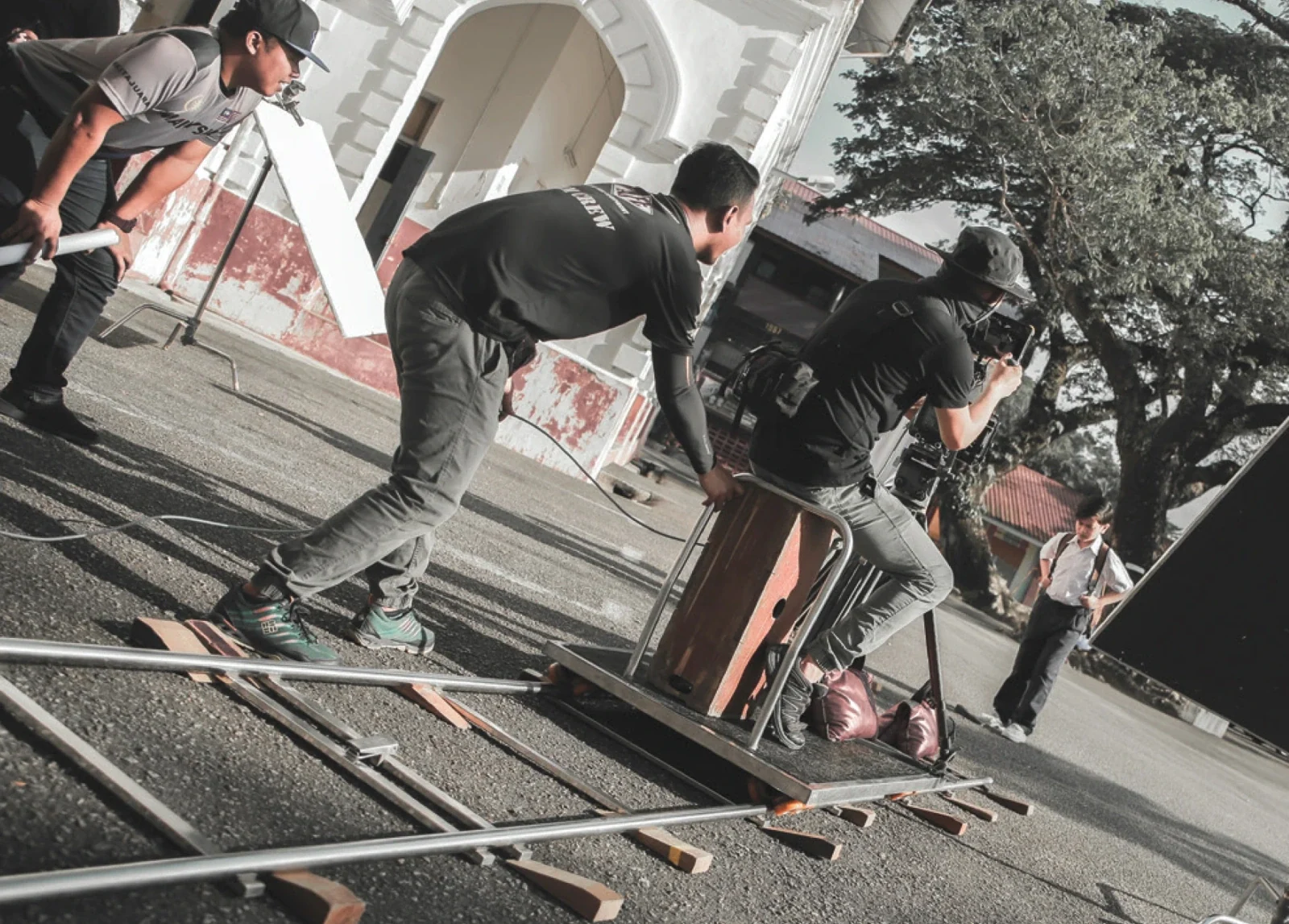 PurplePerfect production crew operating a camera dolly on location