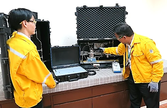 Two people examining research equipment in a UTP storyboard reference