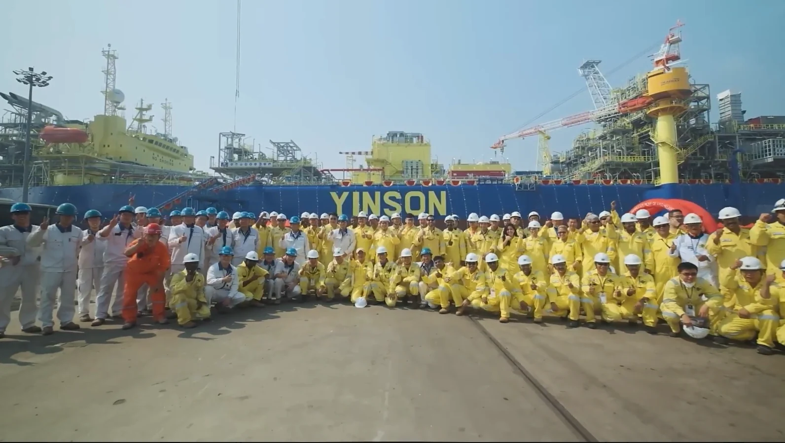 Yinson team assembled beside a vessel, showing people and operational scale